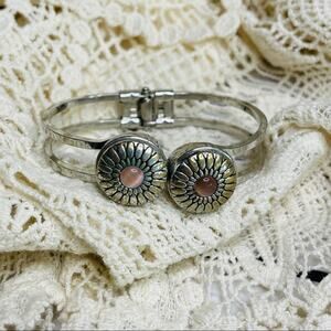 Silver hinged bracelet snap accents pink stones